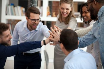 Excited motivated multi-ethnic team people give high five in office Excited motivated multi-ethnic team people give high five, happy diverse office employees executive group celebrate corporate success, sharing victory, engaged in unity support teambuilding concept
